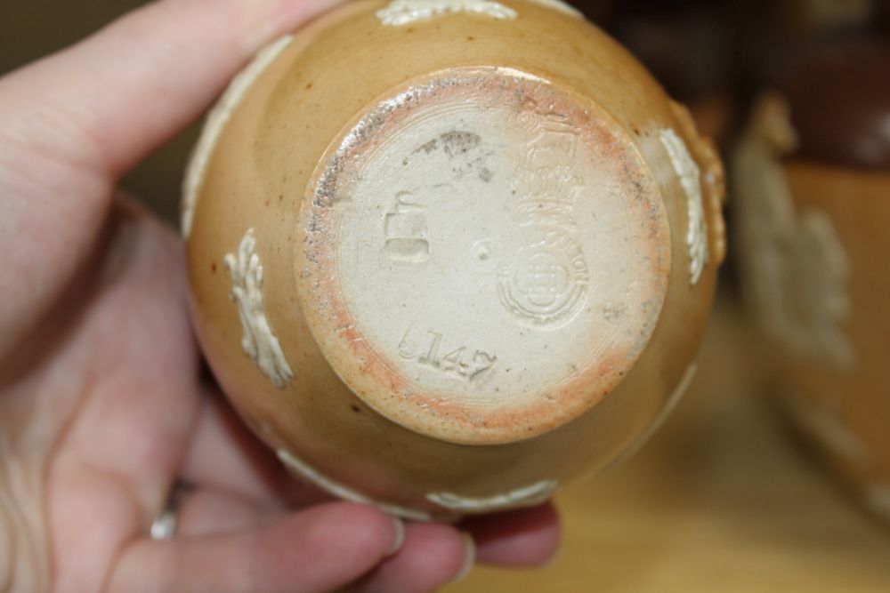 A set of five Royal Doulton graduated stoneware jugs, tallest 19cm